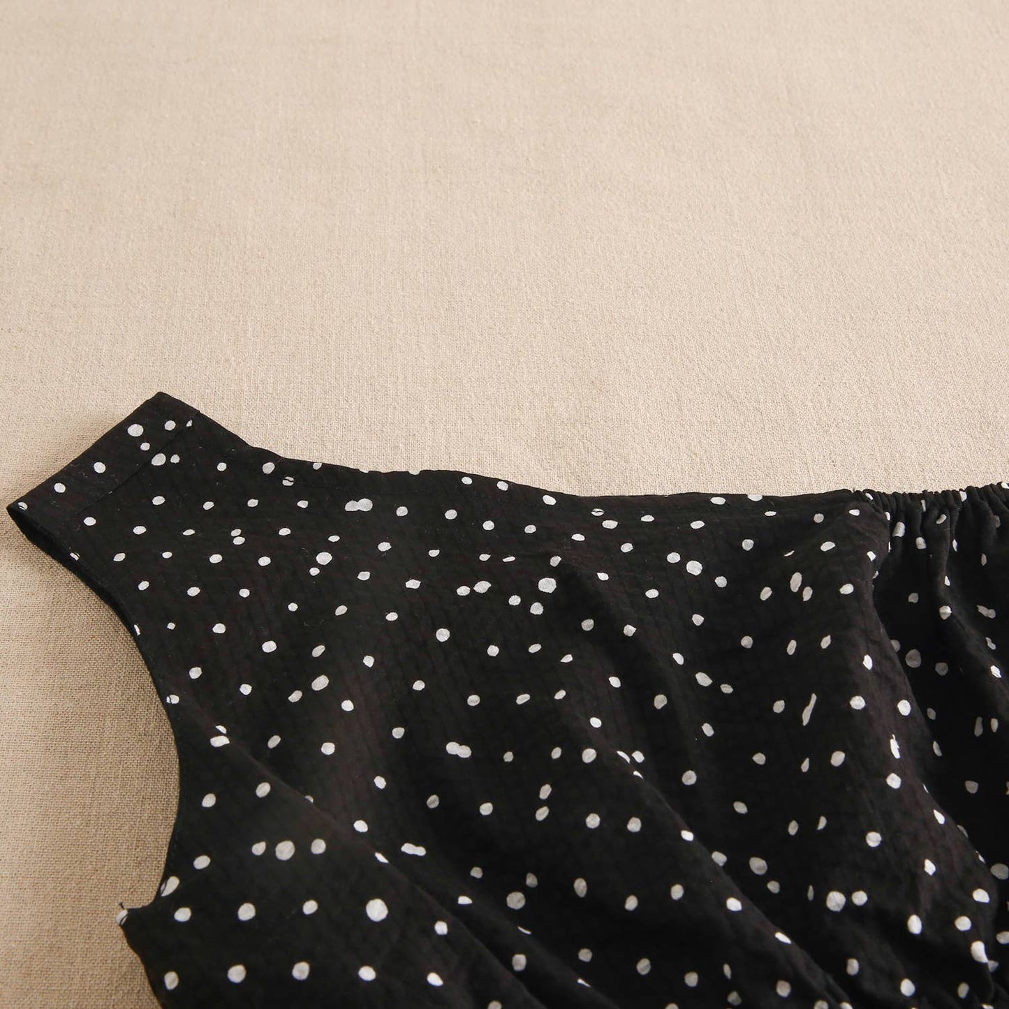 Black girl's dress with white polka dots