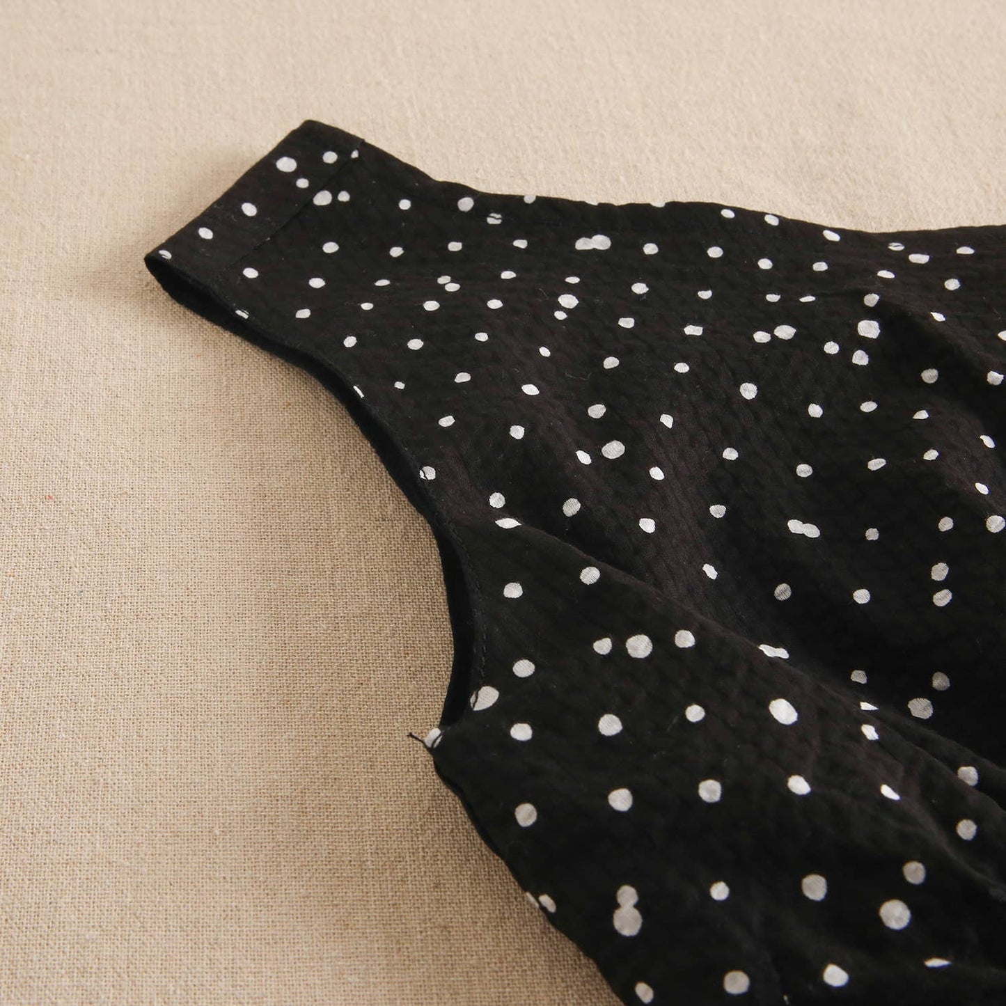 Black girl's dress with white polka dots