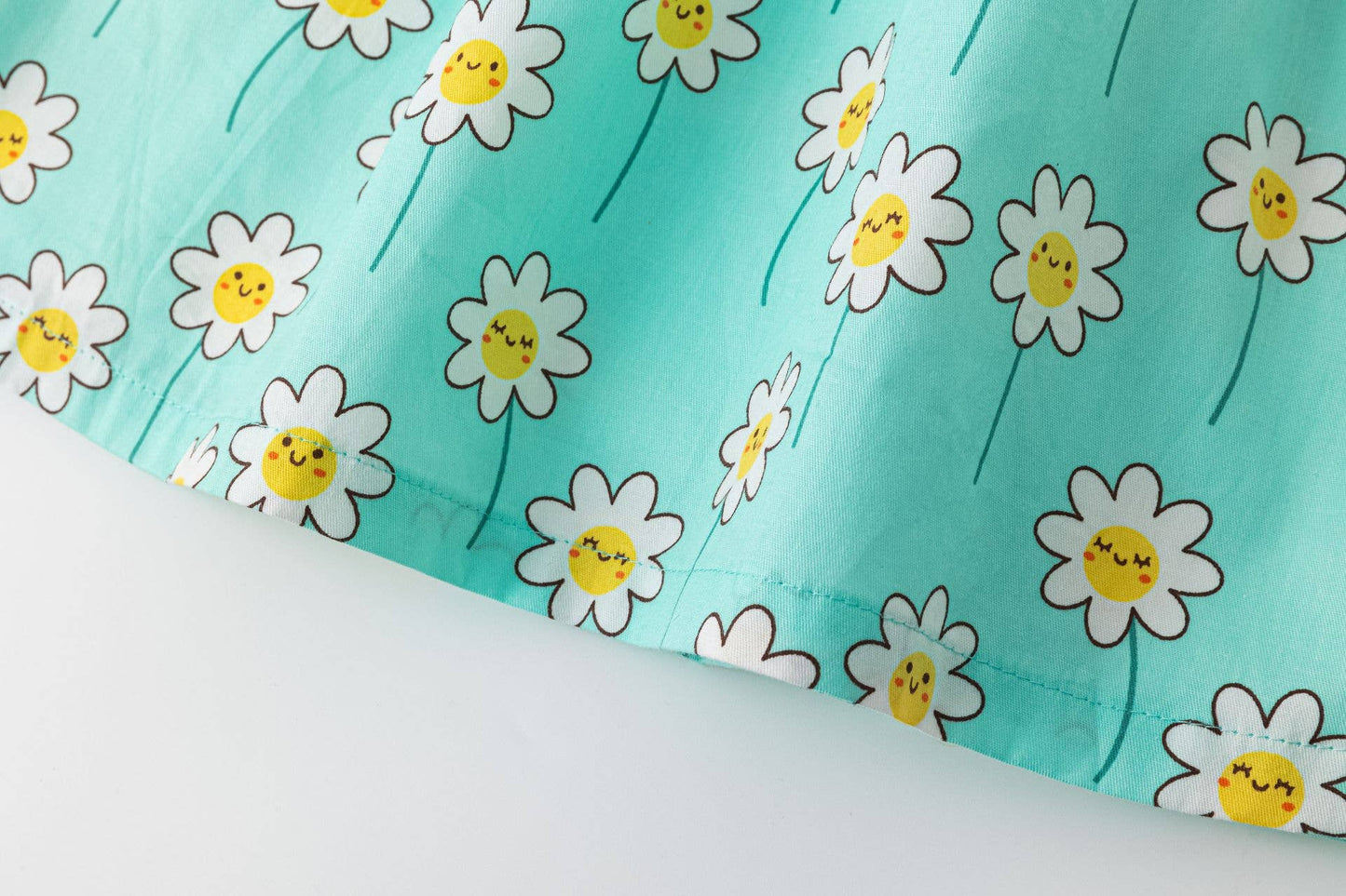 Blue dress with smiling daisies
