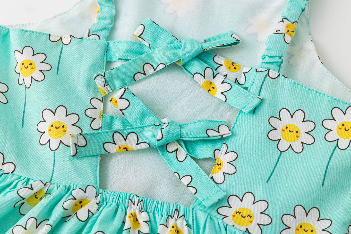 Blue dress with smiling daisies