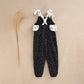 Girls' black jumpsuit with white polka dots