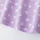 Girls' blouse with ruffle and straps in purple
