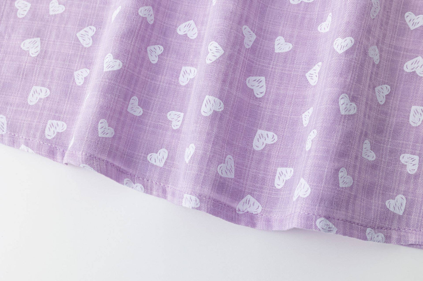 Girls' blouse with ruffle and straps in purple