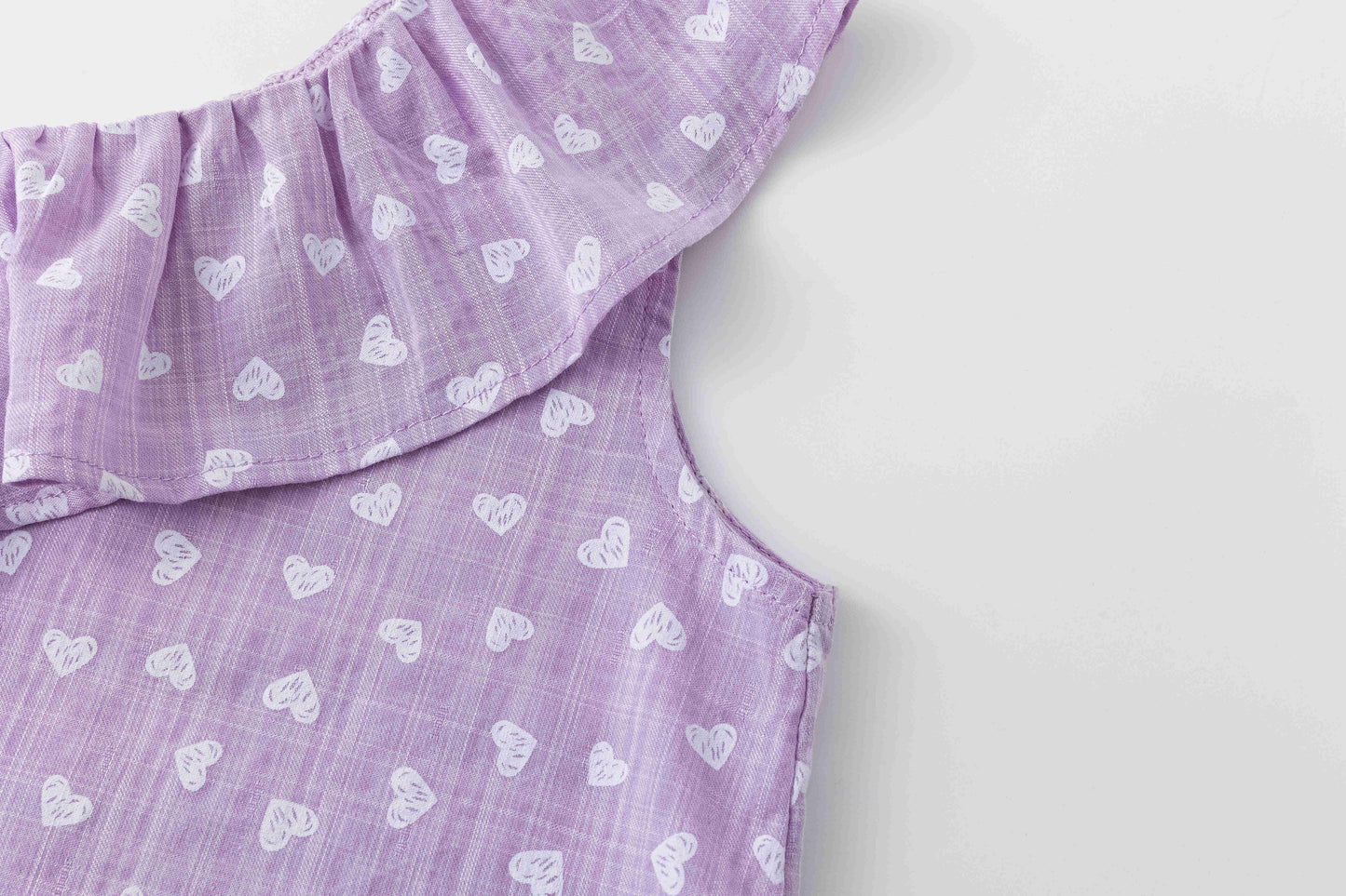 Girls' blouse with ruffle and straps in purple